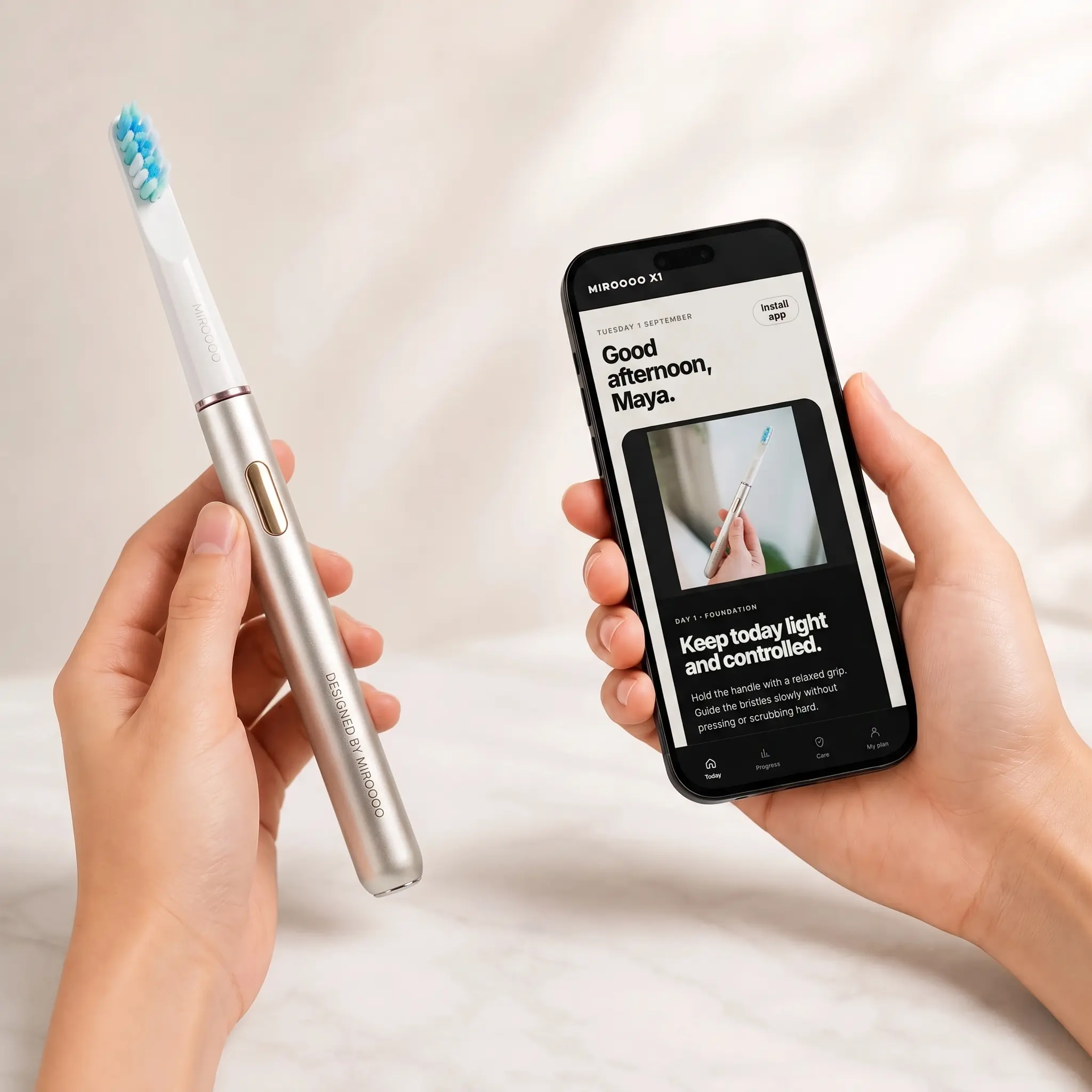 Miroooo sonic electric toothbrush held beside the Smile Coach dental app